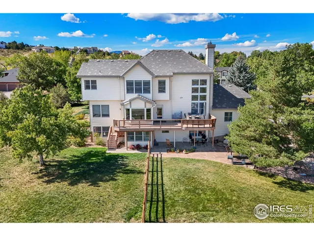 a view of a backyard with sitting area