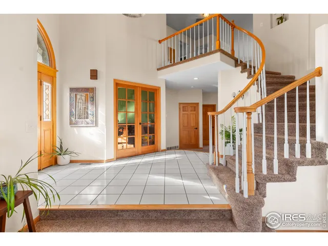 a view of a bedroom with furniture and staircase