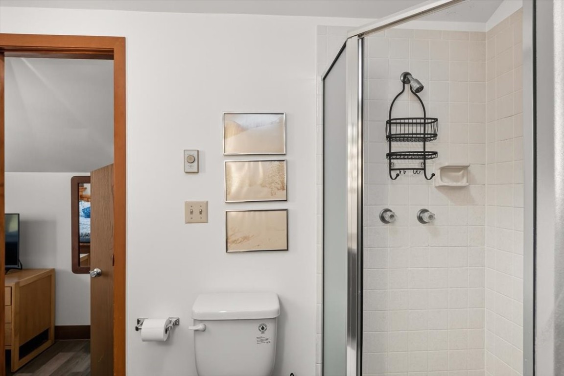 1937 Soda Ridge Road, Unit 1159 Keystone, CO 80435 - Photo 14 of 29 a bathroom that has a glass shower door