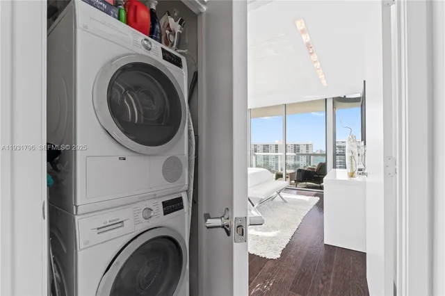 a view of a hallway with washer and dryer