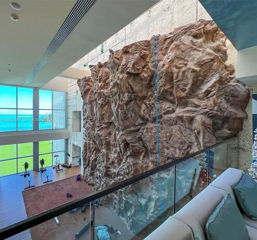 a living room with a couch and a large window