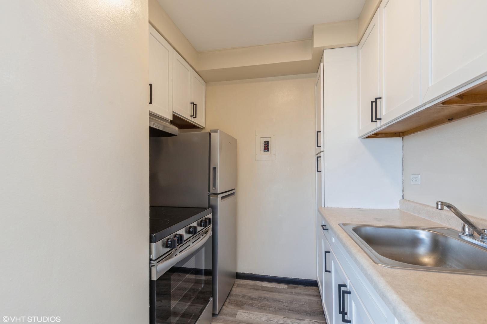 1400 Chicago Avenue, Unit 802 Evanston, IL 60201 - Photo 3 of 9 a kitchen with stainless steel appliances granite countertop a sink stove and refrigerator