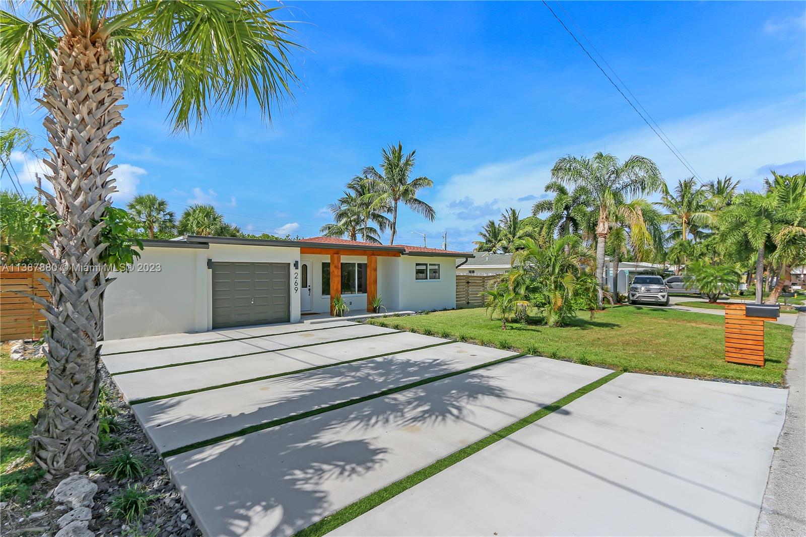 269 Northwest 12th Street Boca Raton, FL 33432 - Photo 2 of 18 a view of a house with a yard