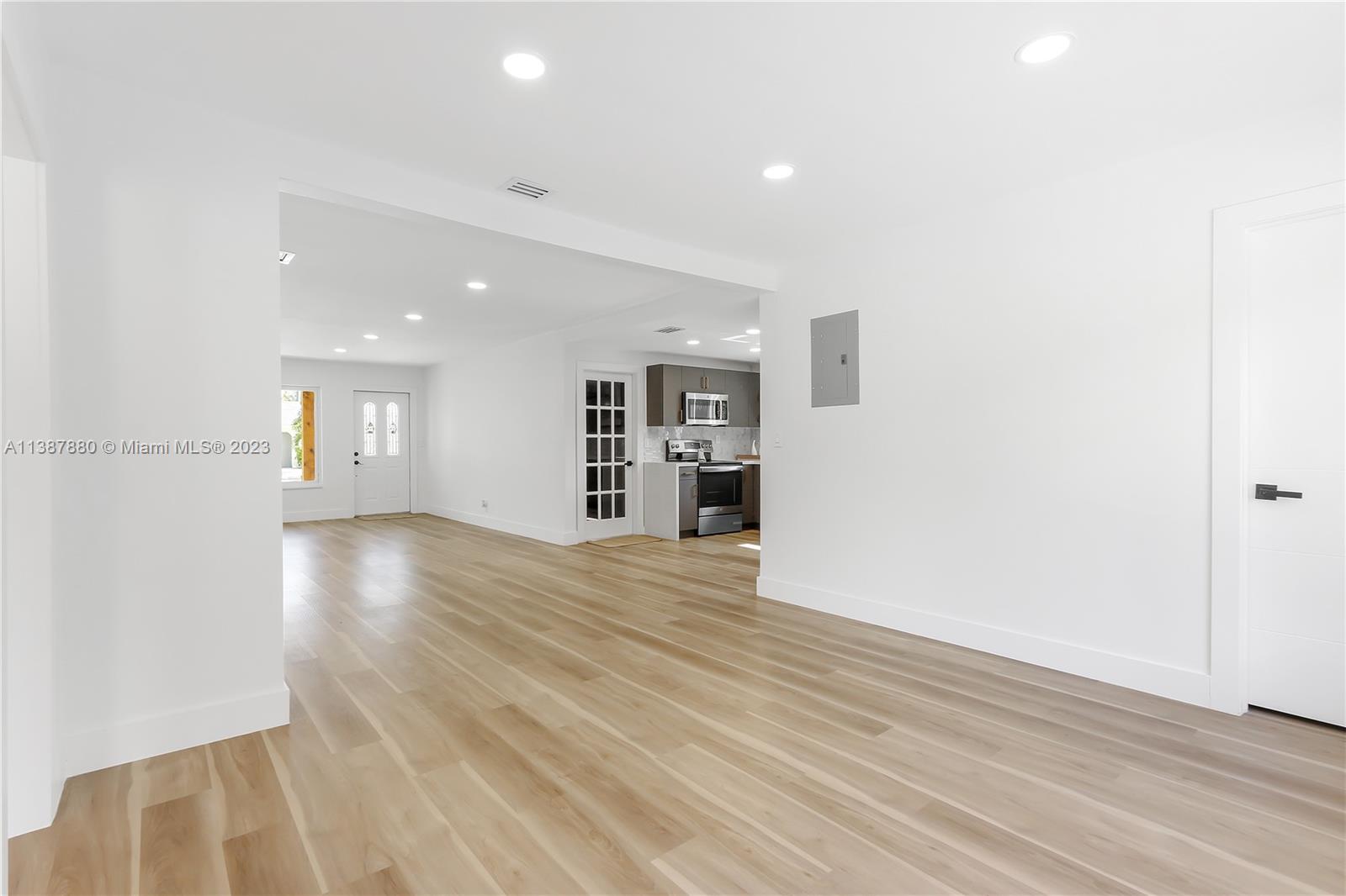 269 Northwest 12th Street Boca Raton, FL 33432 - Photo 5 of 18 wooden floor in an empty room with a window