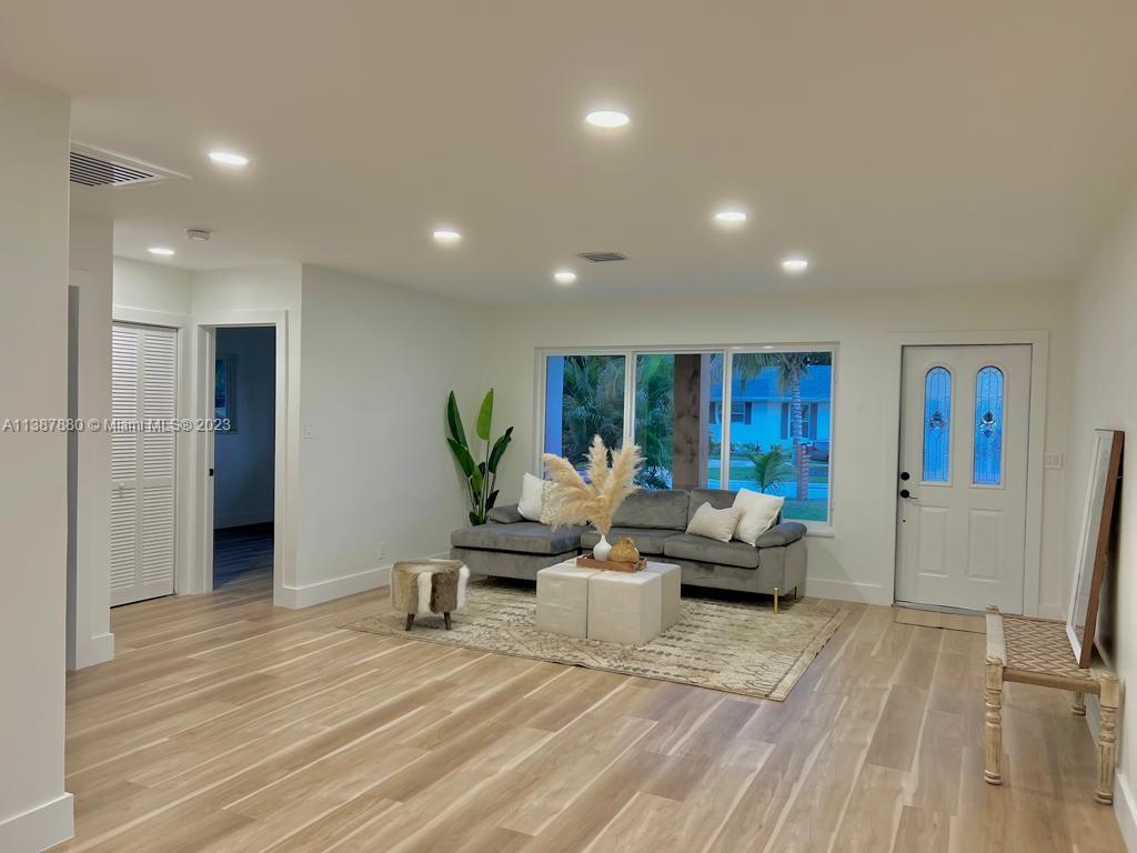 269 Northwest 12th Street Boca Raton, FL 33432 - Photo 6 of 18 a living room with furniture and a wooden floor