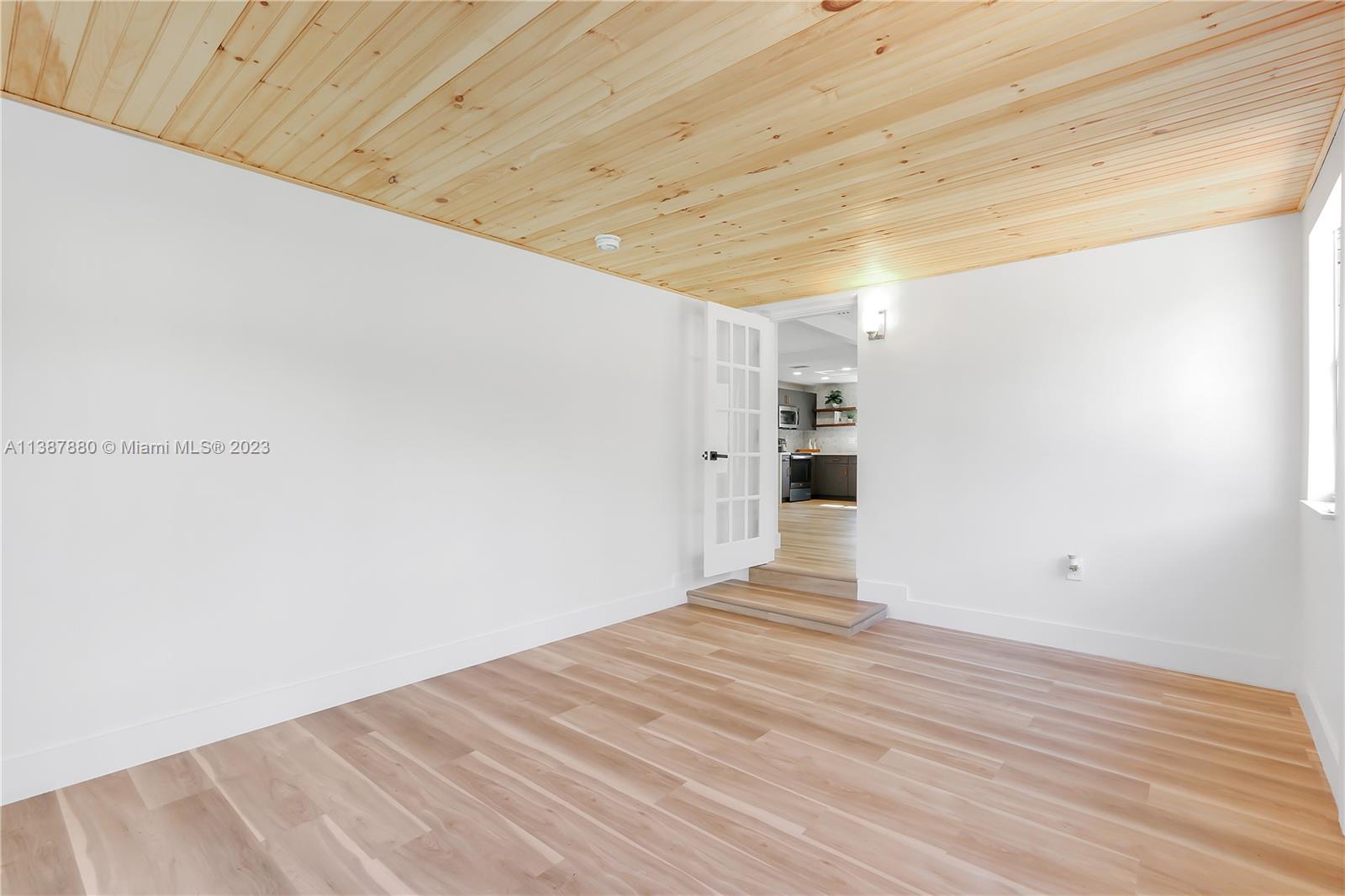 269 Northwest 12th Street Boca Raton, FL 33432 - Photo 10 of 18 a view of empty room with wooden floor