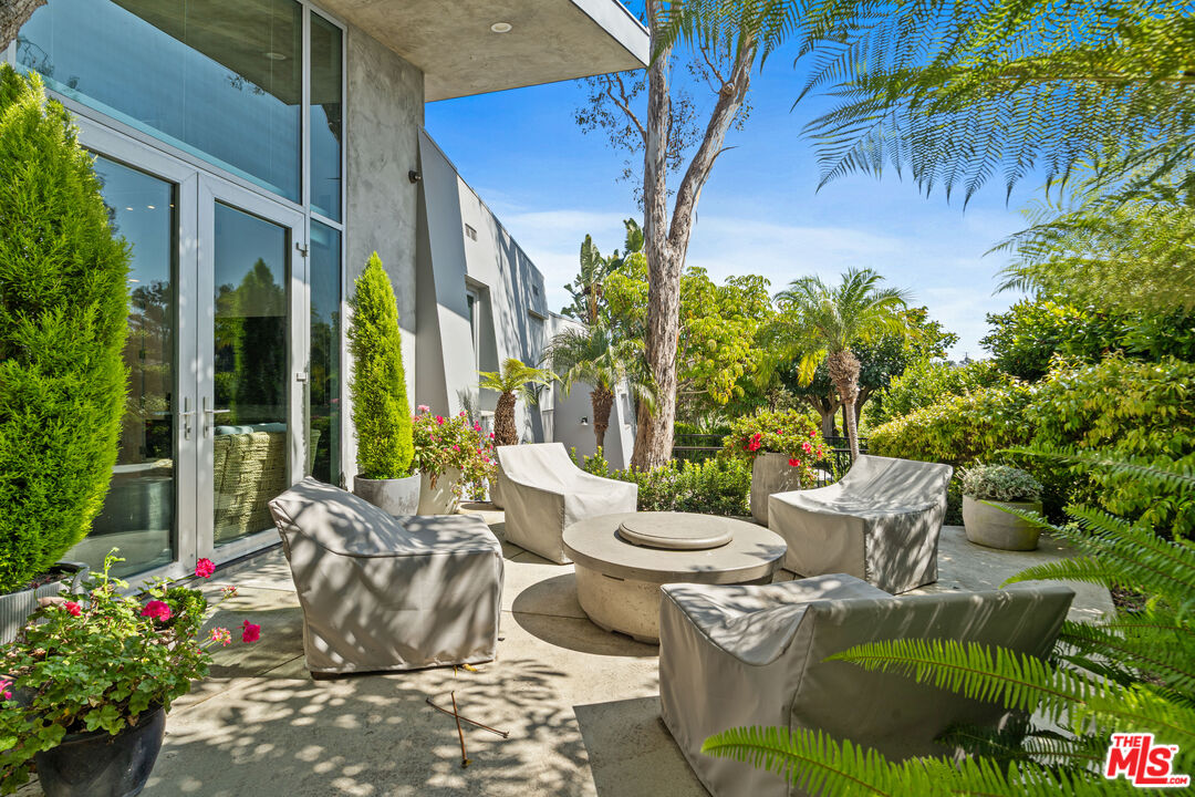 28775 Sea Ranch Way Malibu, CA 90265 - Photo 20 of 21 a view of a patio with couple of chairs and potted plants