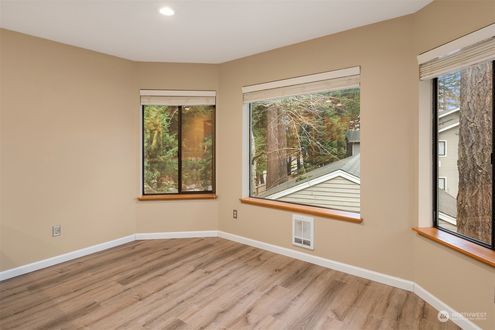9009 Avondale Road Northeast, Unit R 235 Redmond, WA 98052 - Photo 14 of 24 a view of empty room with wooden floor and fan