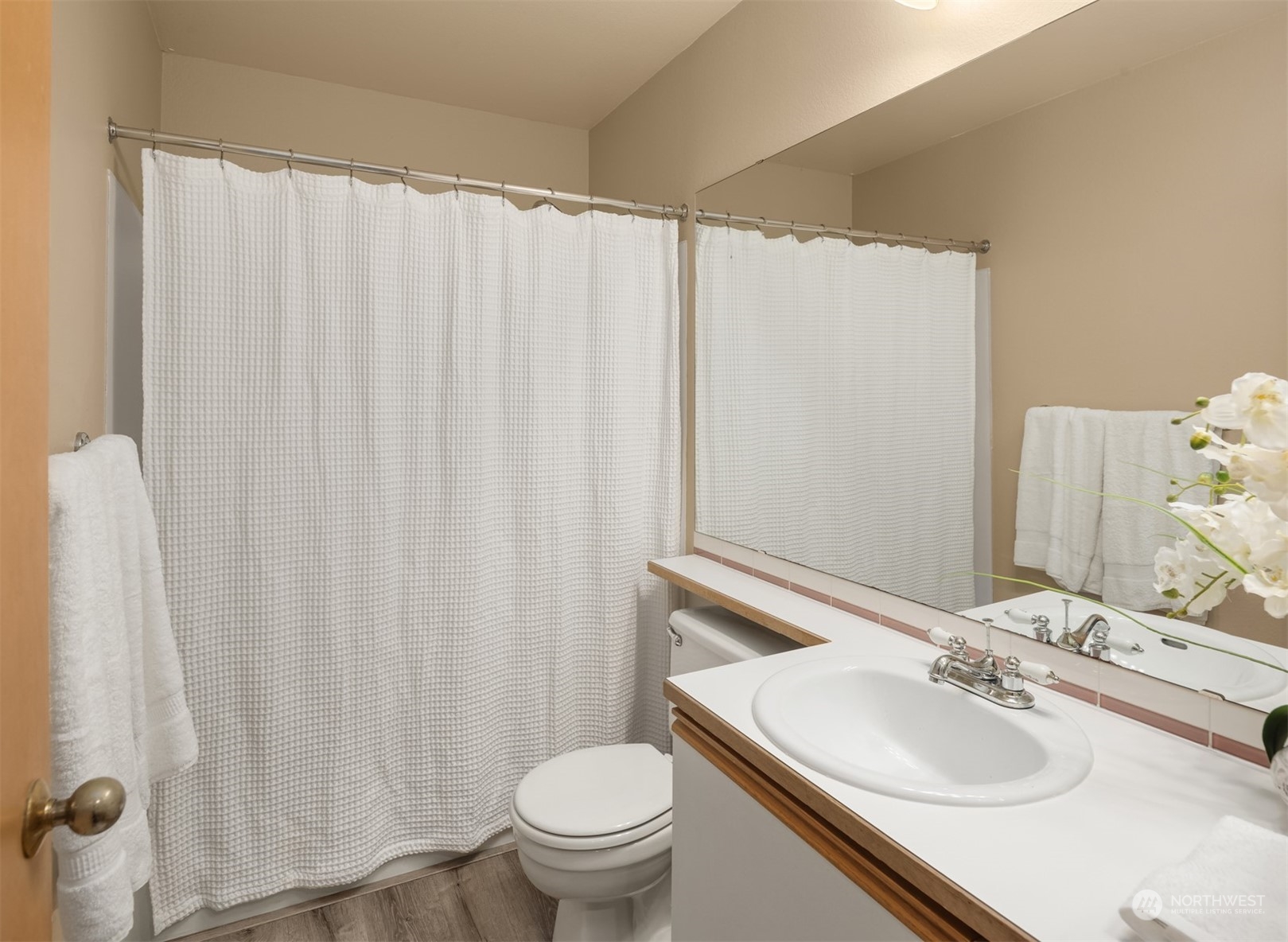 9009 Avondale Road Northeast, Unit R 235 Redmond, WA 98052 - Photo 22 of 24 a bathroom with a sink and a mirror