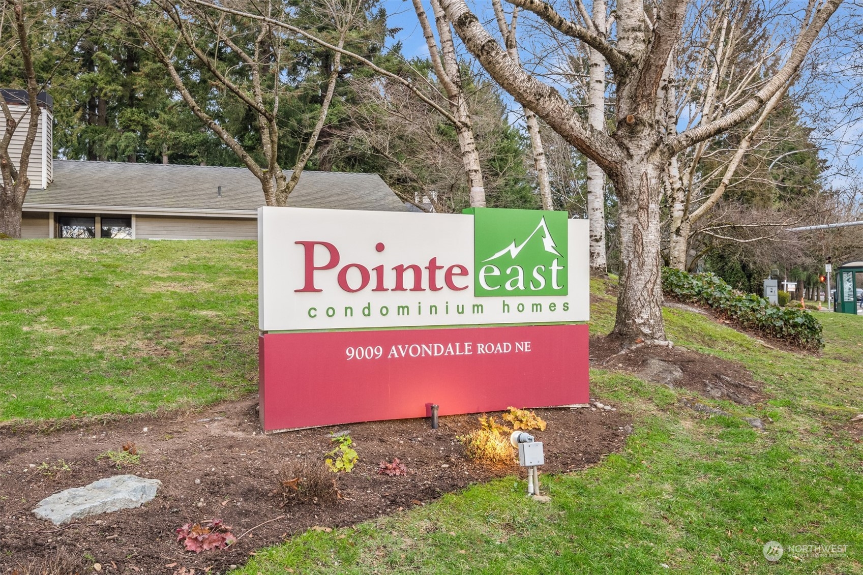 9009 Avondale Road Northeast, Unit R 235 Redmond, WA 98052 - Photo 24 of 24 a sign that is sitting on a brick wall