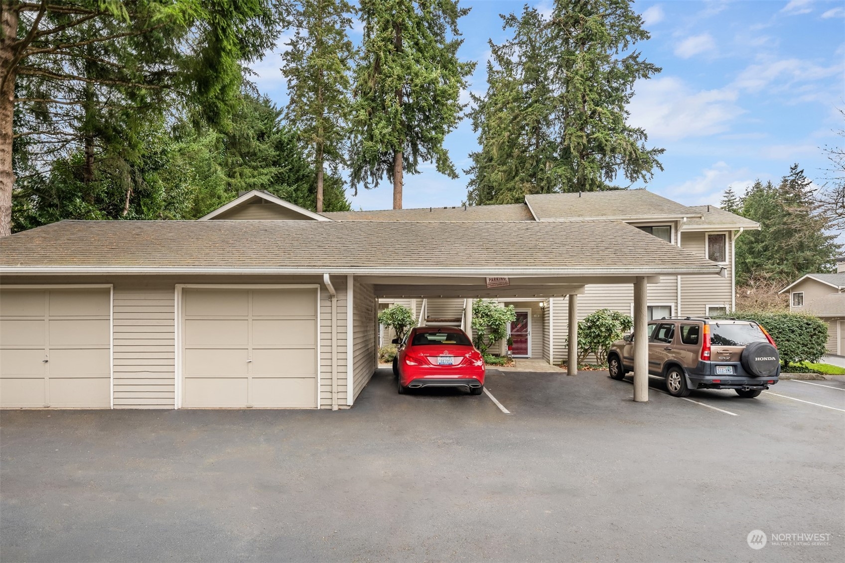 9009 Avondale Road Northeast, Unit R 235 Redmond, WA 98052 - Photo 5 of 24 a car parked in front of house