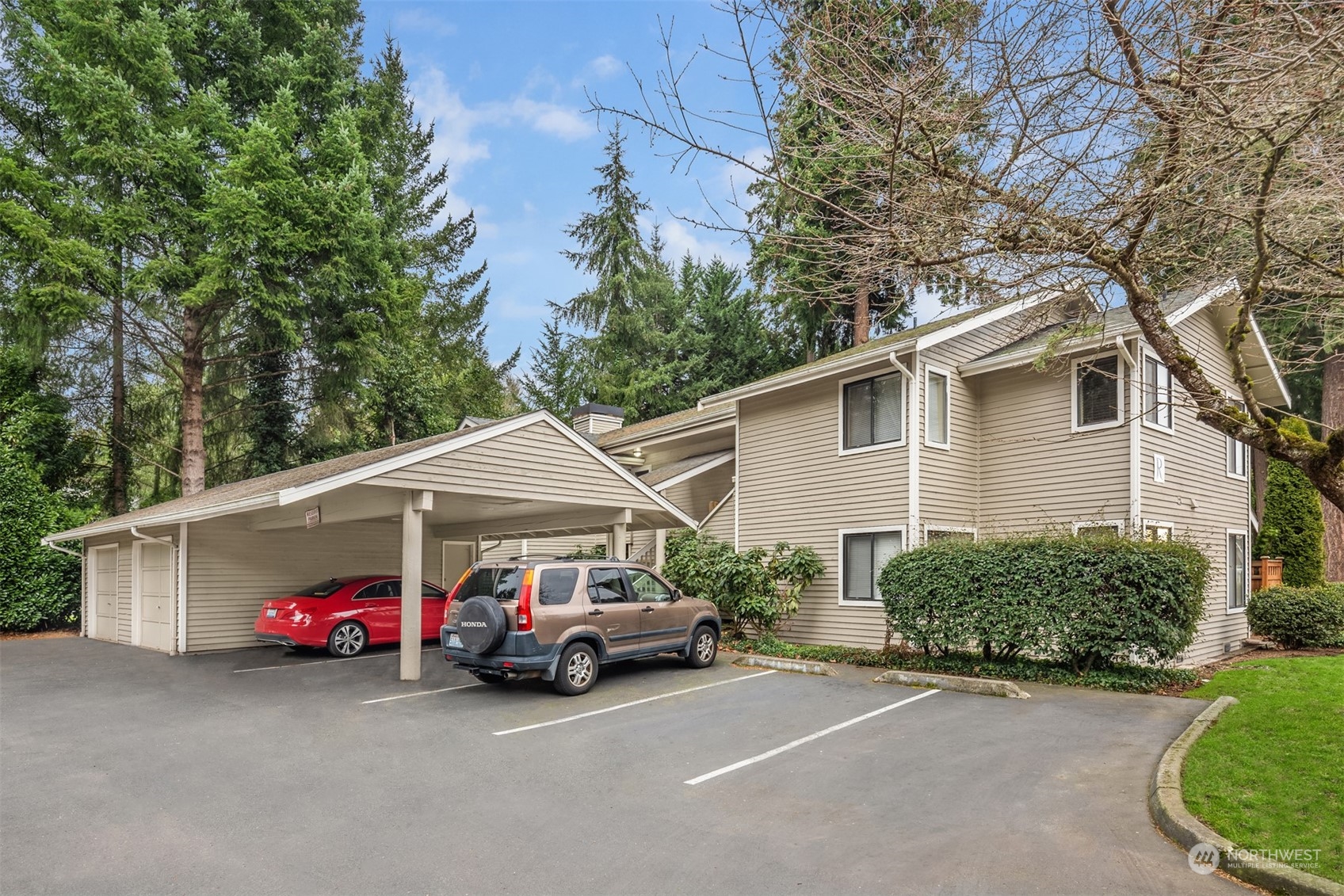 9009 Avondale Road Northeast, Unit R 235 Redmond, WA 98052 - Photo 6 of 24 a view of a car parked in front of a house