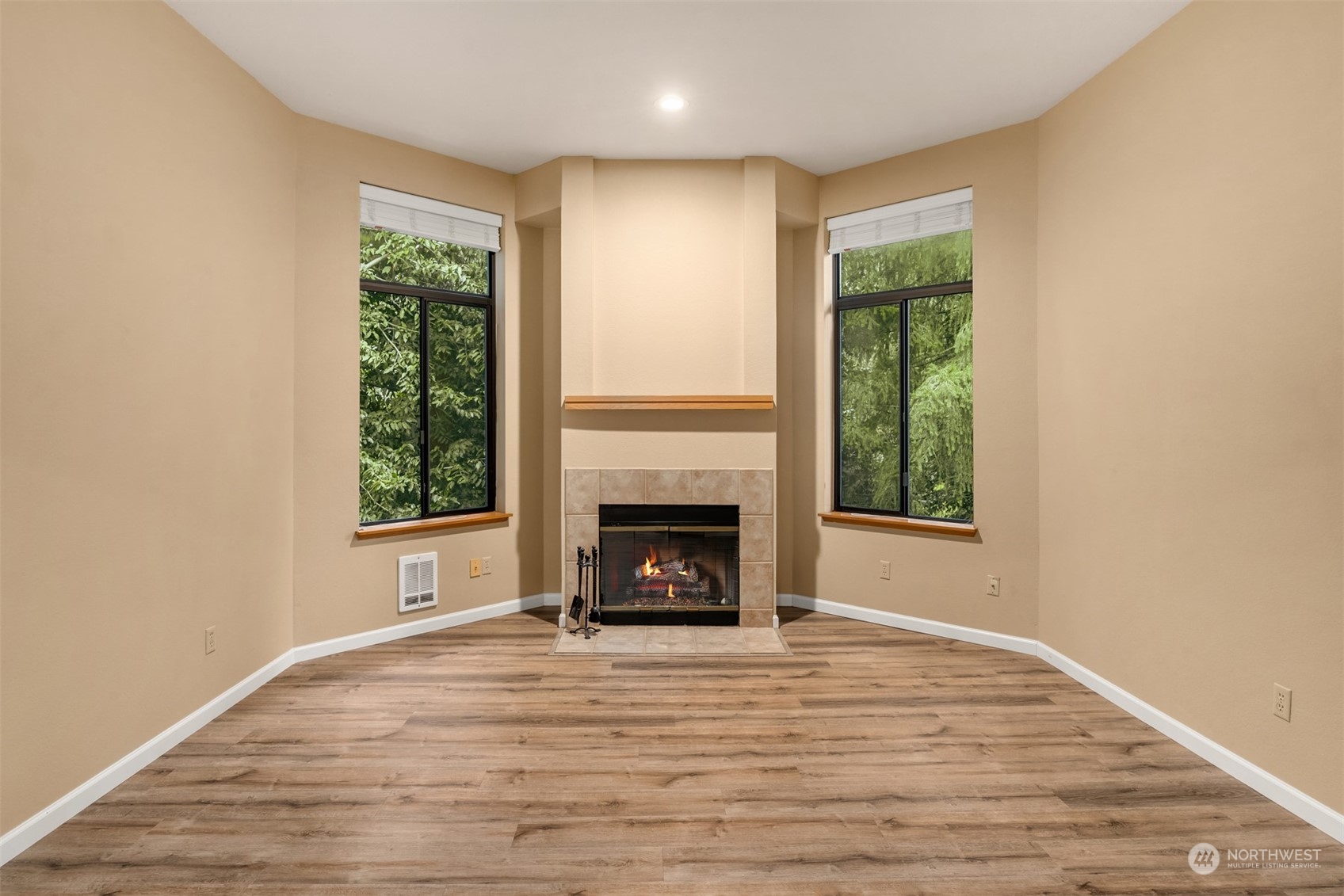 9009 Avondale Road Northeast, Unit R 235 Redmond, WA 98052 - Photo 7 of 24 a view of an empty room with window and fire place
