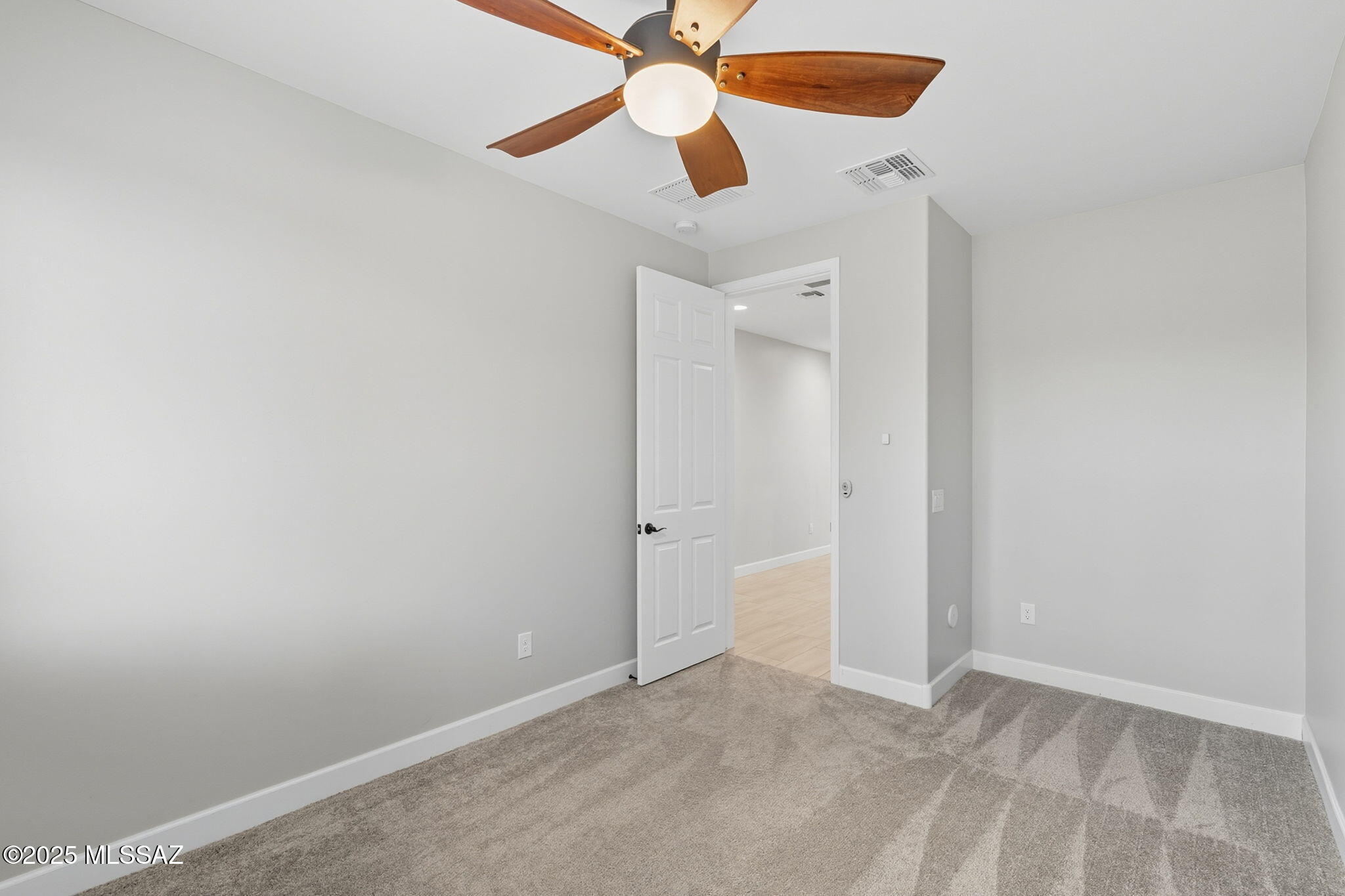 12100 East Ryscott Circle Vail, AZ 85641 - Photo 18 of 53 an empty room and chandelier fan