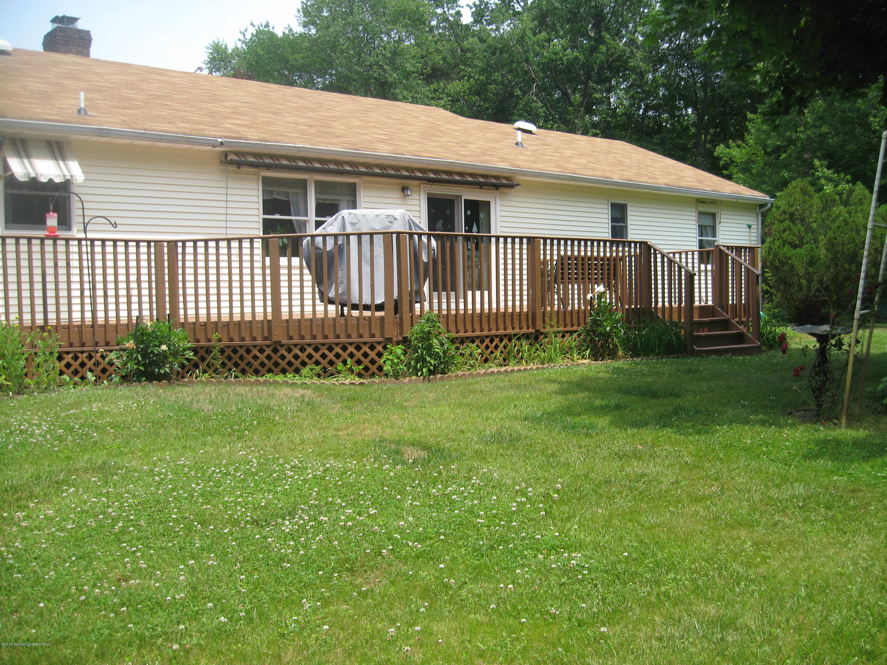 428 Oak Tree Road Freehold, NJ 07728 - Photo 14 of 18 a front view of a house with garden