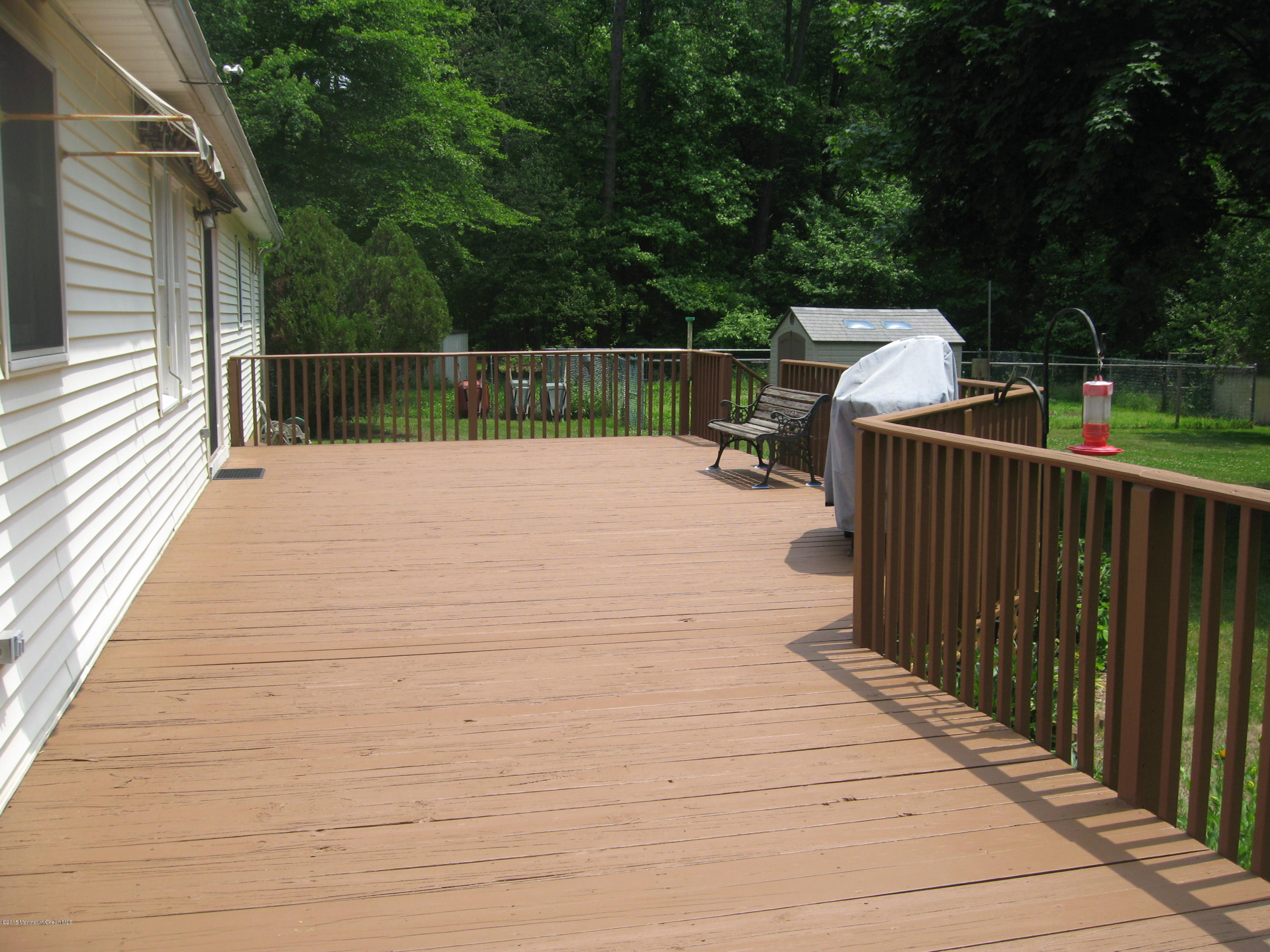 428 Oak Tree Road Freehold, NJ 07728 - Photo 3 of 18 a view of a terrace with trees