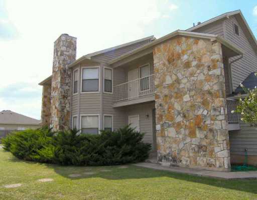 8701 Schick Road Austin, TX 78729 - Photo 1 of 1 a front view of a house with garden