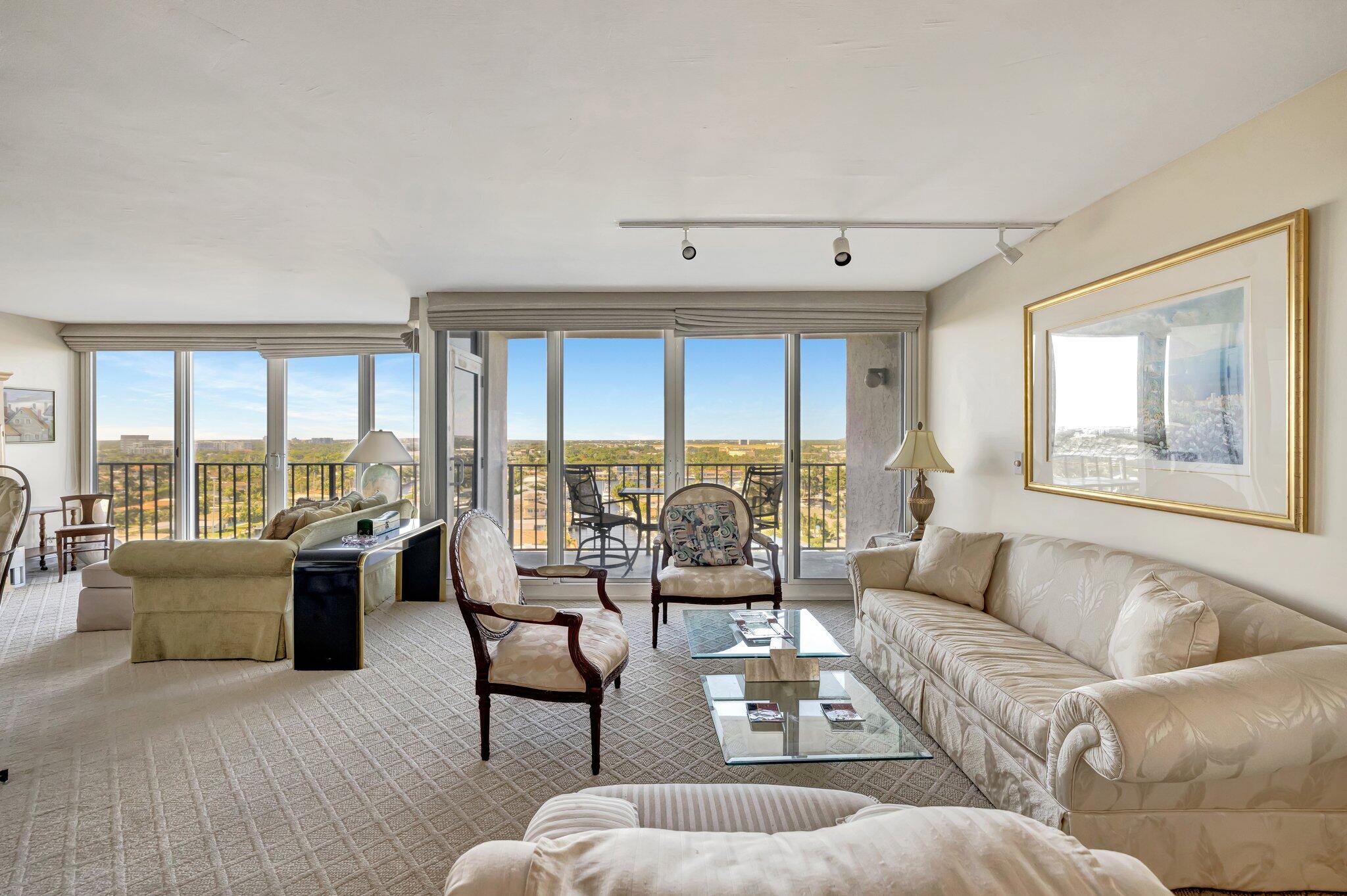 521 North Riverside Drive, Unit 1207 Pompano Beach, FL 33062 - Photo 13 of 50 a living room with furniture and large windows