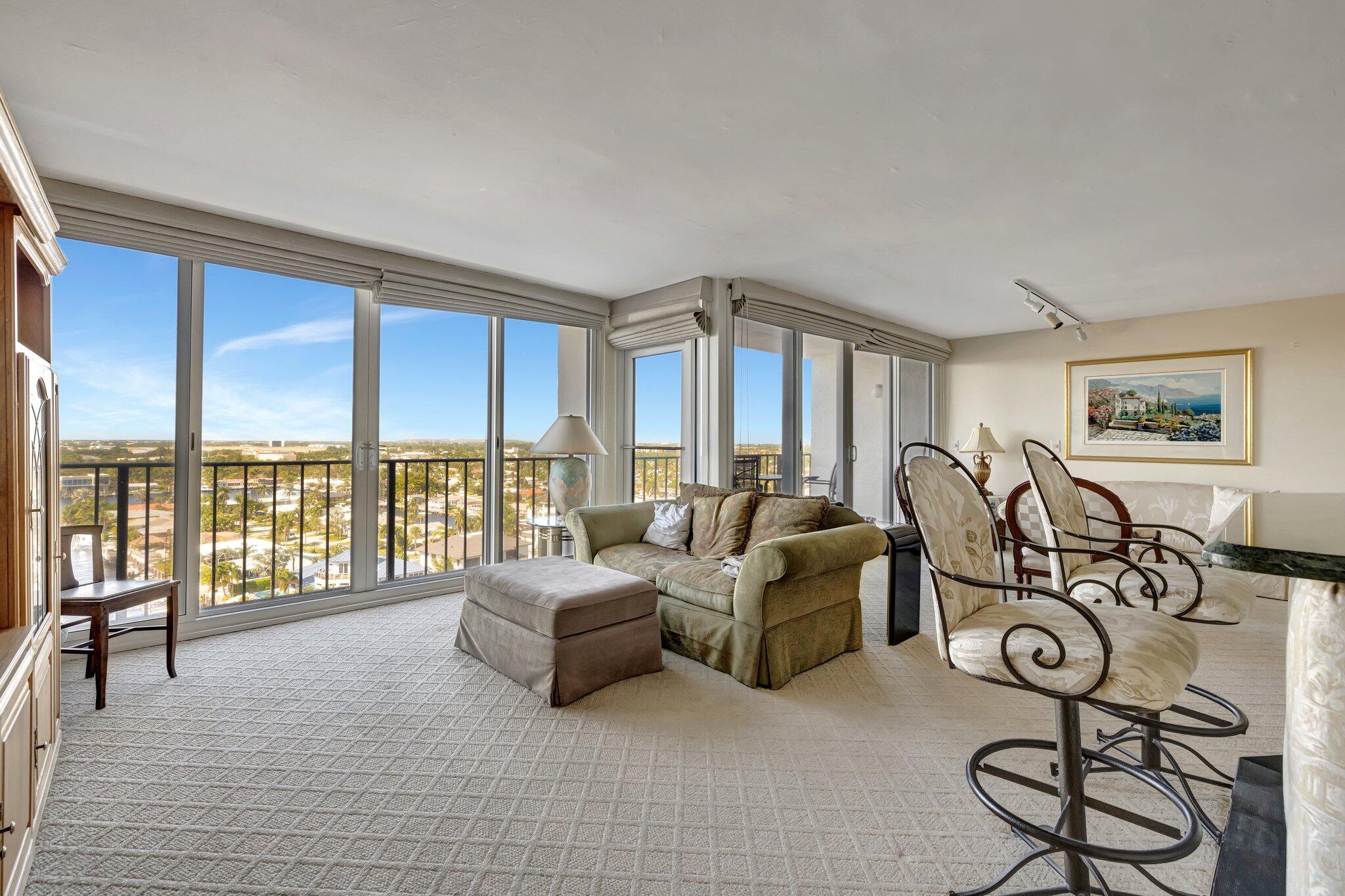 521 North Riverside Drive, Unit 1207 Pompano Beach, FL 33062 - Photo 18 of 50 a spacious bedroom with furniture and a large window