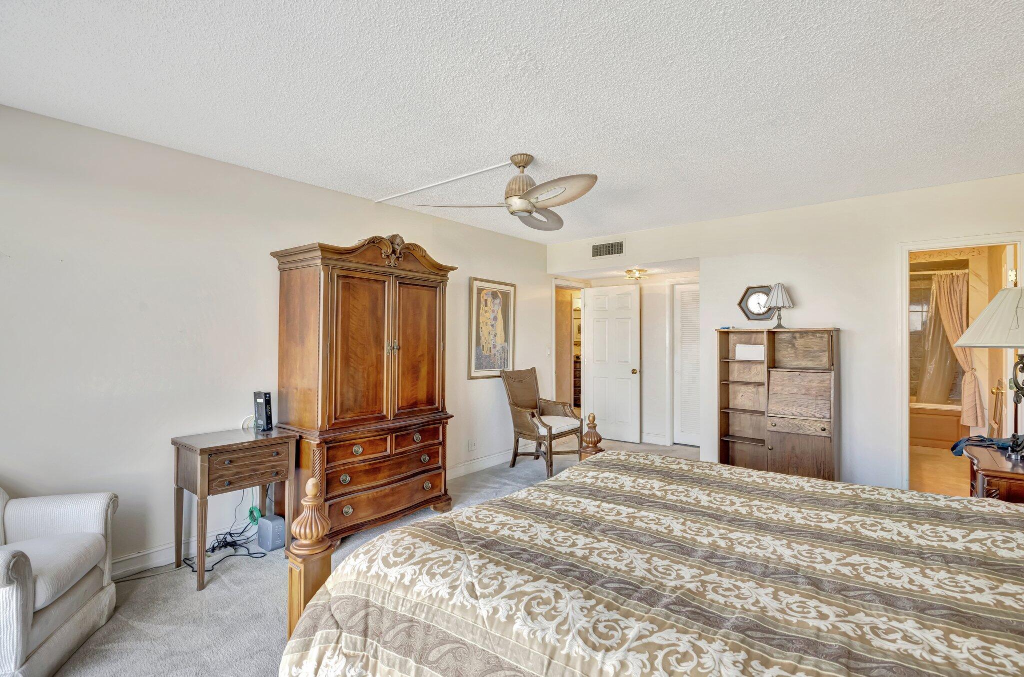 521 North Riverside Drive, Unit 1207 Pompano Beach, FL 33062 - Photo 33 of 50 a bedroom with a bed and a television