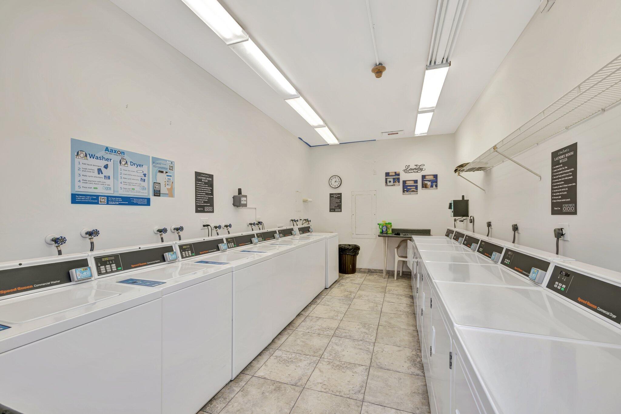 521 North Riverside Drive, Unit 1207 Pompano Beach, FL 33062 - Photo 41 of 50 a large white kitchen with a large window