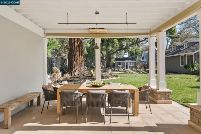 a bathroom with a granite countertop sink toilet tub and shower