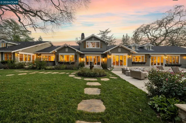a view of a patio with a dining table and chairs