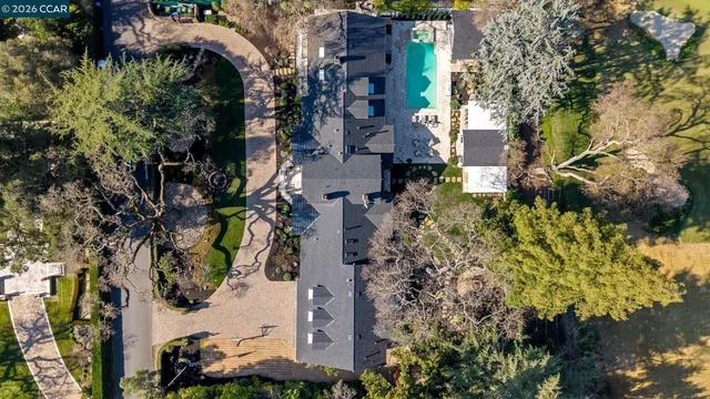 a large kitchen with lots of counter top space and stainless steel appliances
