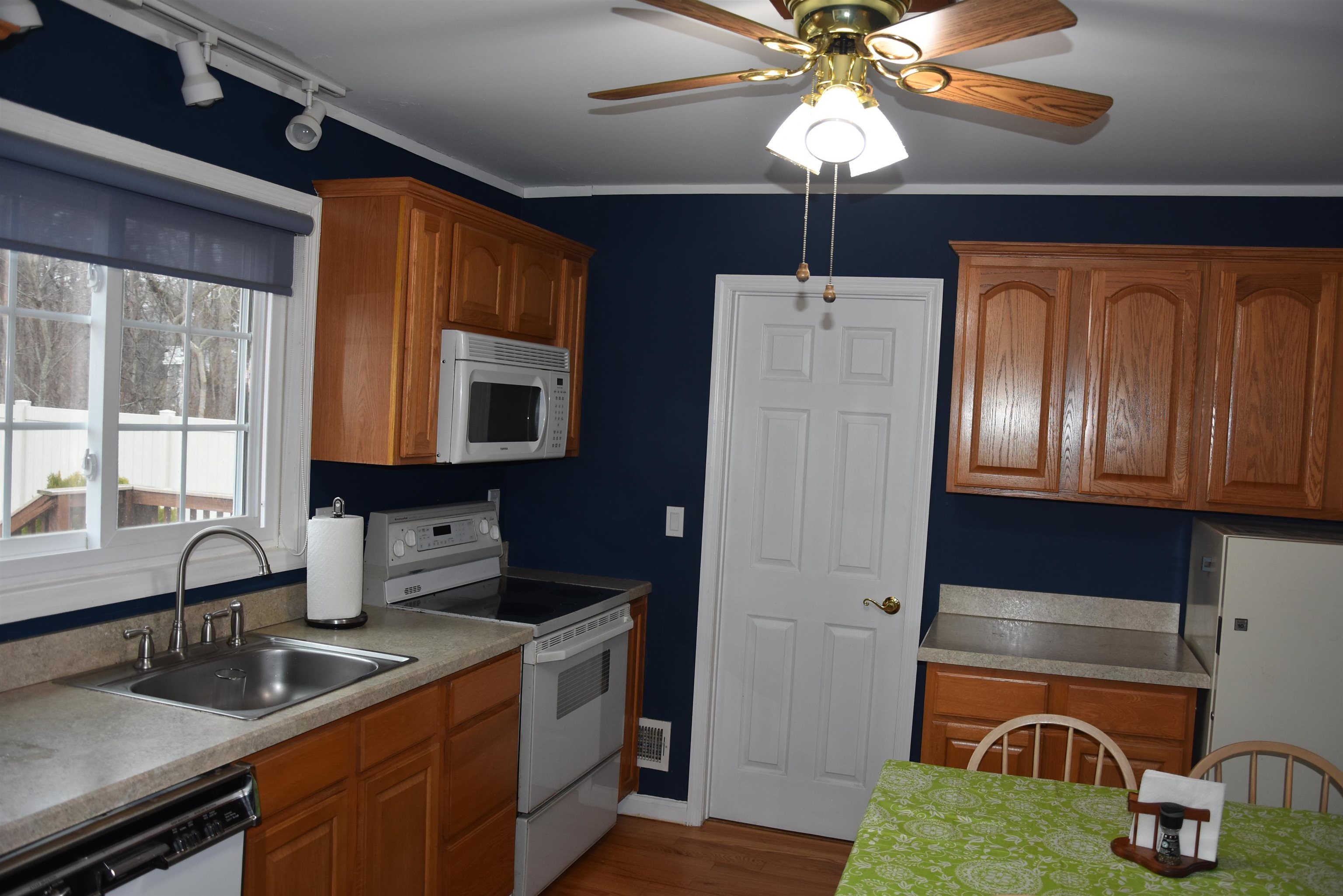 7 Corson Lane Ocean View, NJ 08230 - Photo 18 of 36 a kitchen with a refrigerator and a sink