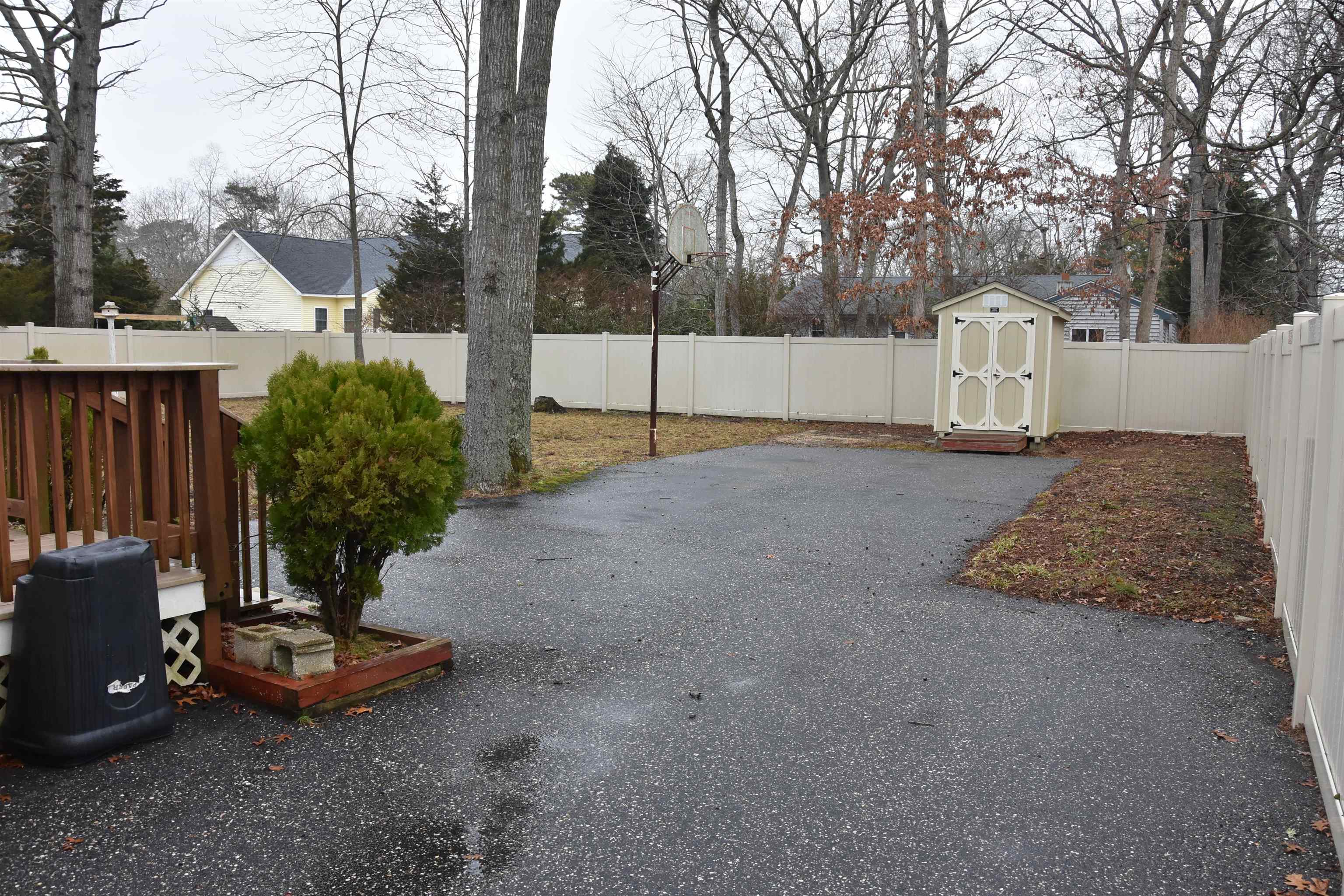 7 Corson Lane Ocean View, NJ 08230 - Photo 3 of 36 a view of a backyard with table and chairs and wooden fence