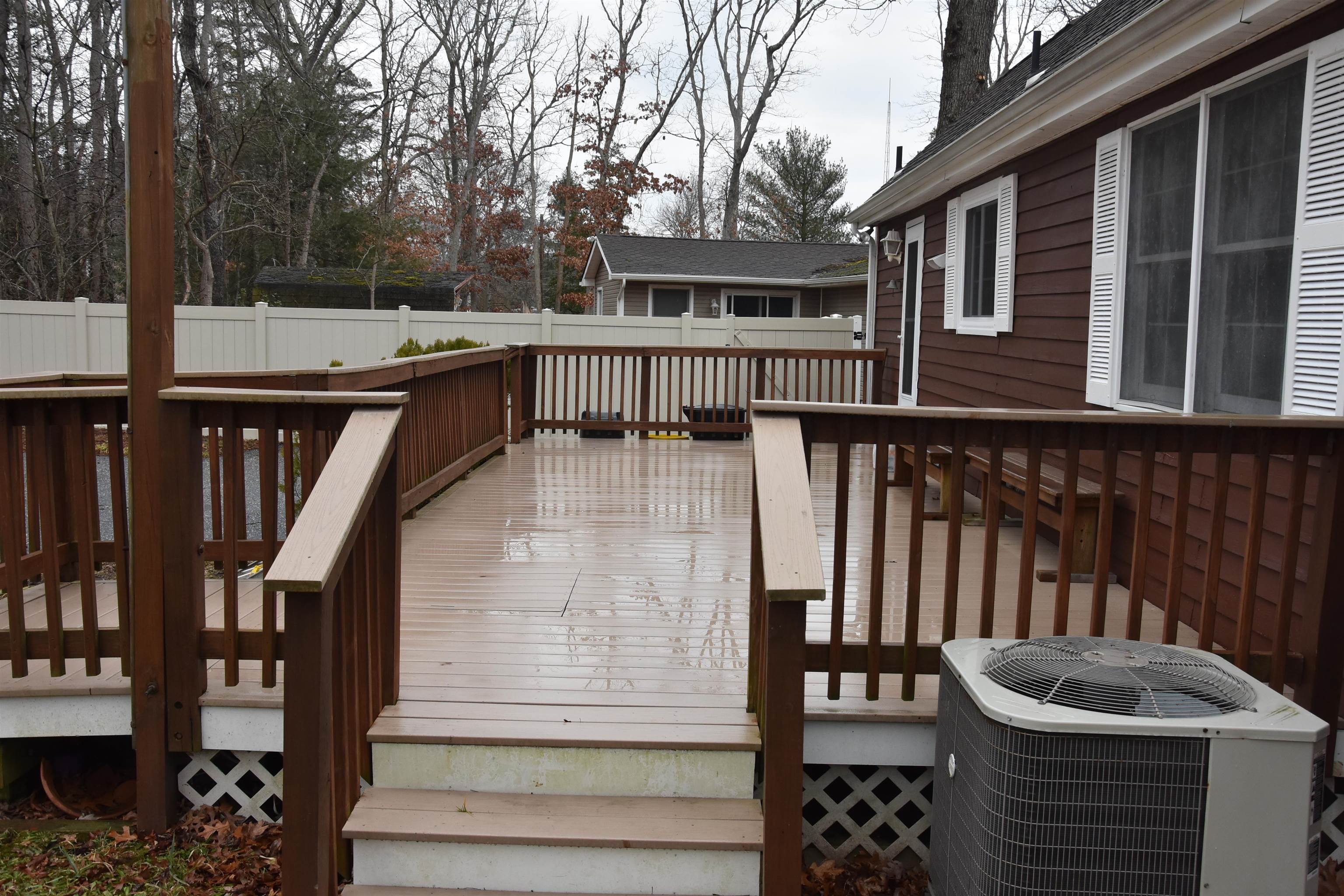 7 Corson Lane Ocean View, NJ 08230 - Photo 6 of 36 a balcony with table and chairs