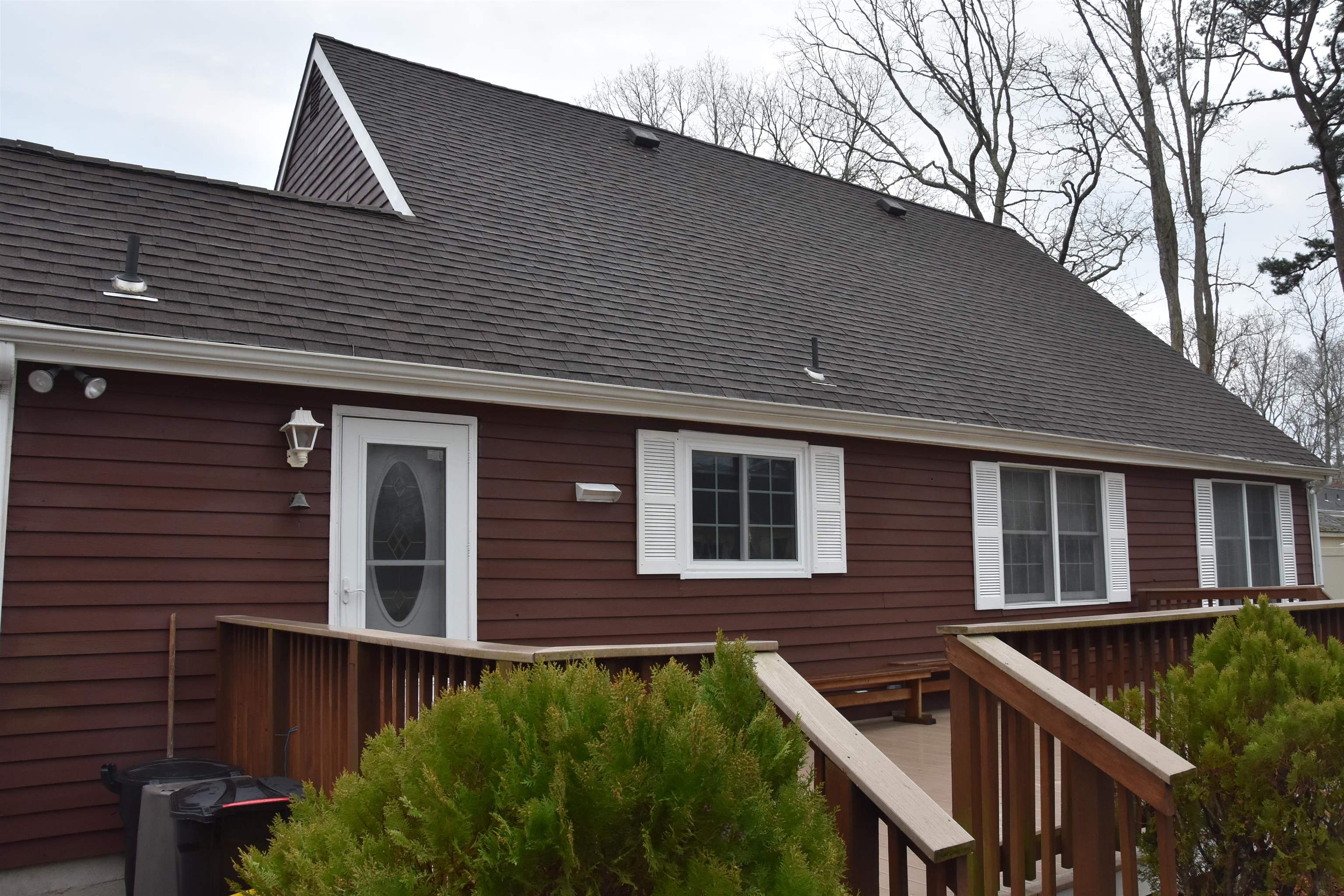 7 Corson Lane Ocean View, NJ 08230 - Photo 7 of 36 a front view of house with yard and trees in the background