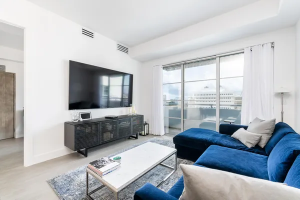 a living room with furniture and a flat screen tv