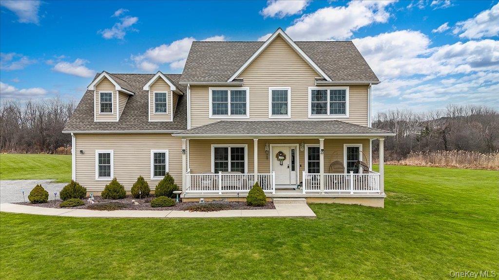 77 Houston Road Goshen, NY 10924 - Photo 2 of 46 a front view of a house with a yard