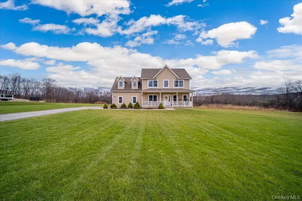 a view of a house with a big yard