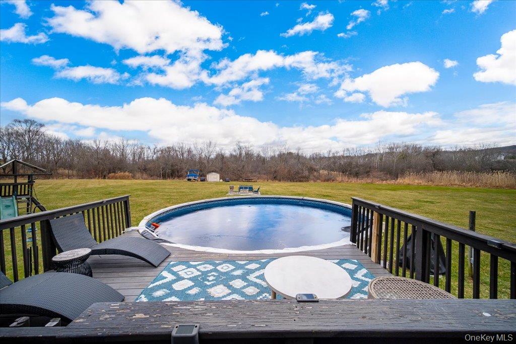 77 Houston Road Goshen, NY 10924 - Photo 38 of 46 a view of swimming pool with outdoor seating and city view