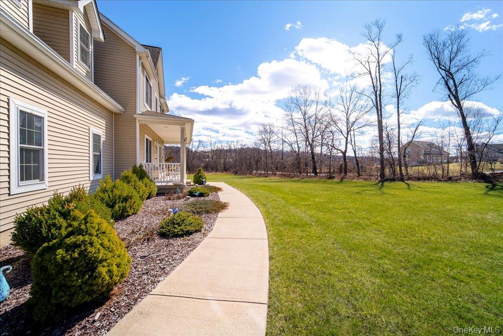 77 Houston Road Goshen, NY 10924 - Photo 4 of 46 a view of a fountain in front of a house with a big yard