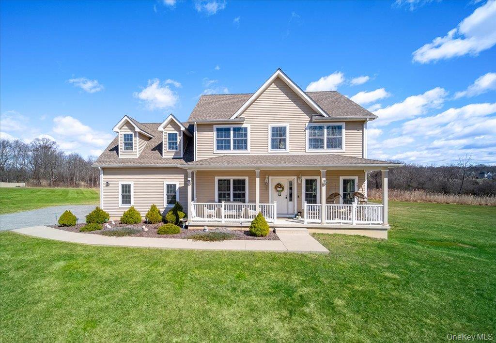 77 Houston Road Goshen, NY 10924 - Photo 44 of 46 a front view of a house with a yard table and chairs