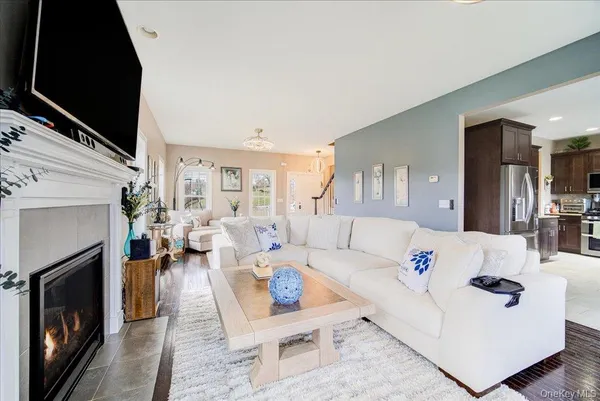 a living room with furniture fireplace and a flat screen tv