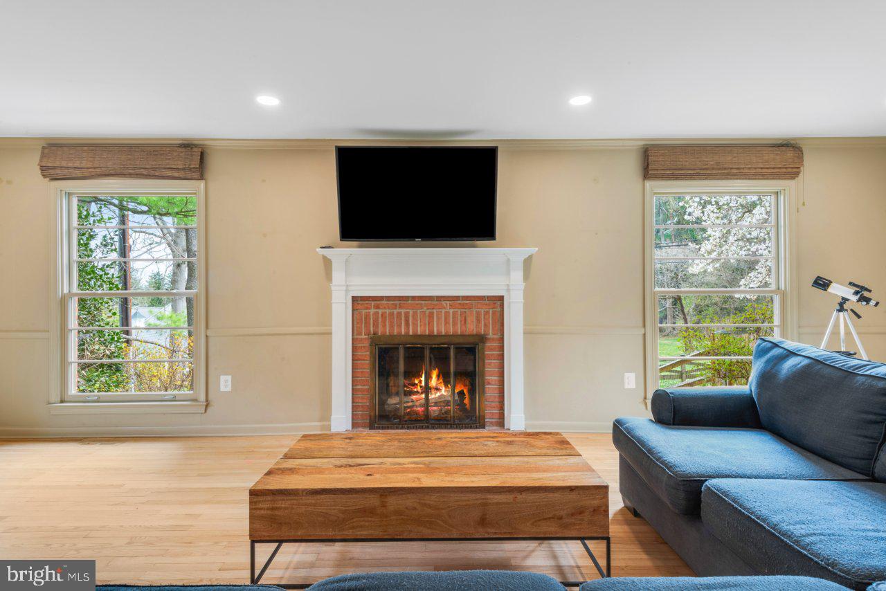 1803 Thornton Ridge Road Baltimore, MD 21204 - Photo 12 of 81 a living room with furniture and a fireplace