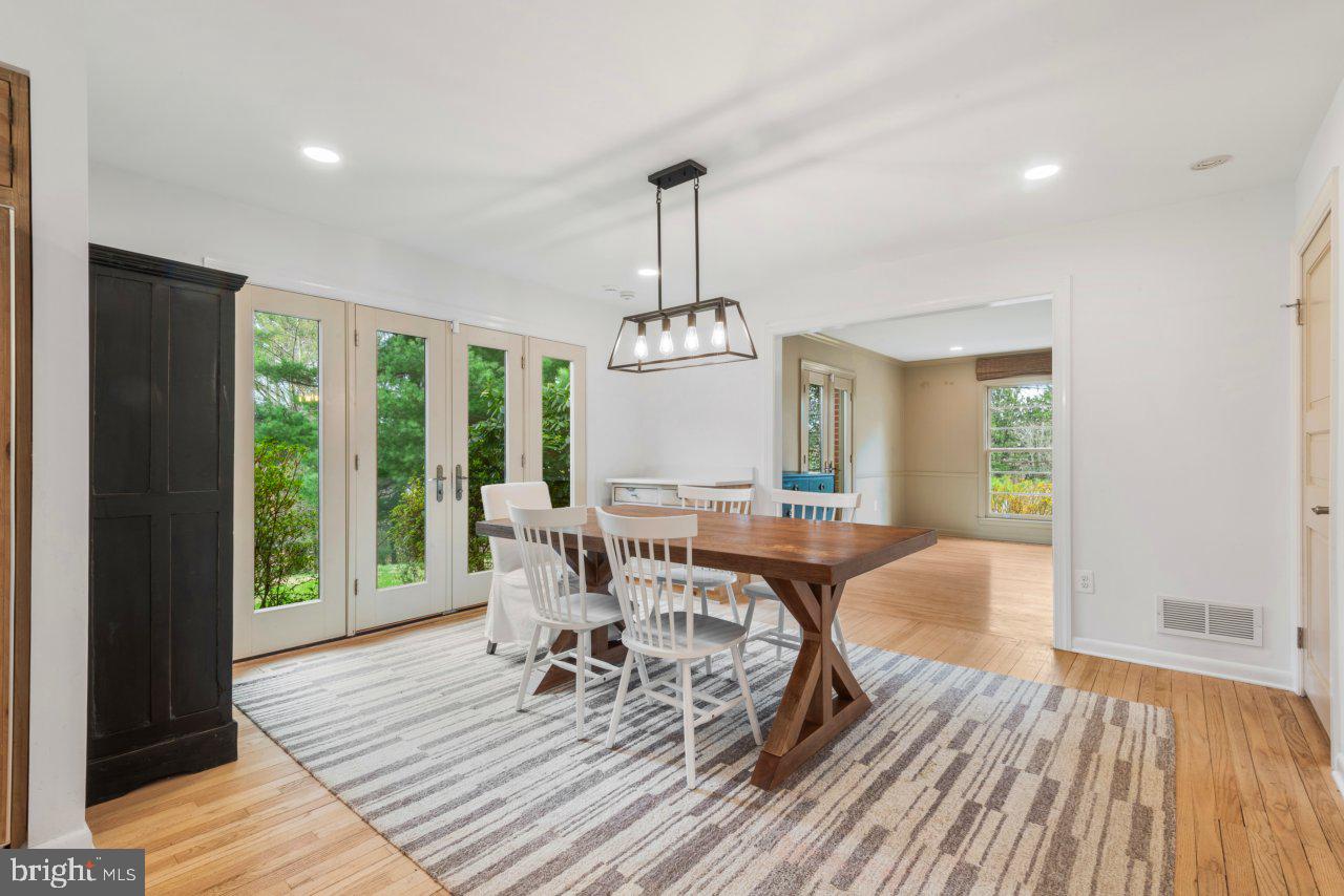 1803 Thornton Ridge Road Baltimore, MD 21204 - Photo 78 of 81 a view of a dining room with furniture window and wooden floor