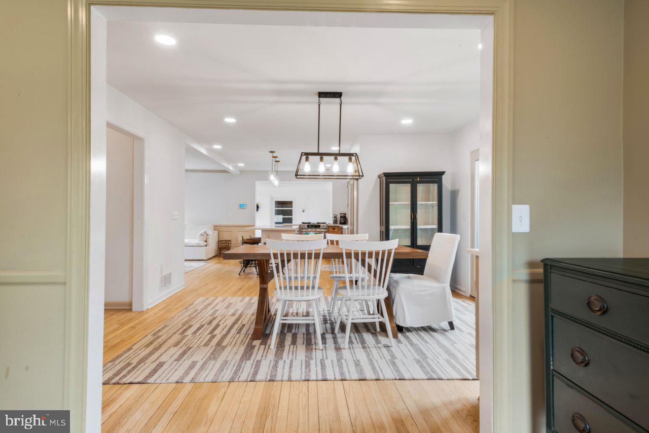 1803 Thornton Ridge Road Baltimore, MD 21204 - Photo 79 of 81 a view of a dining room with furniture and wooden floor