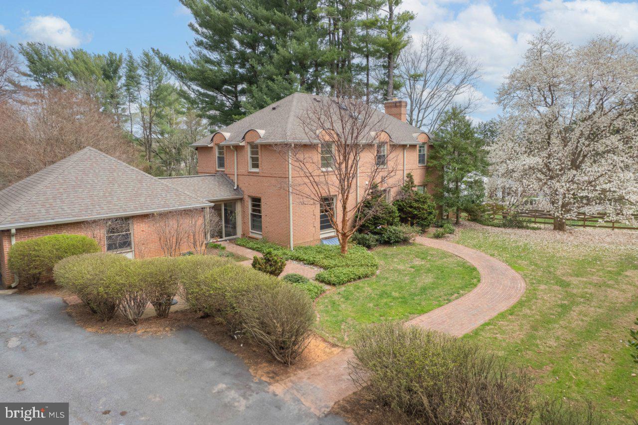 1803 Thornton Ridge Road Baltimore, MD 21204 - Photo 3 of 81 a aerial view of a house with a yard and large trees