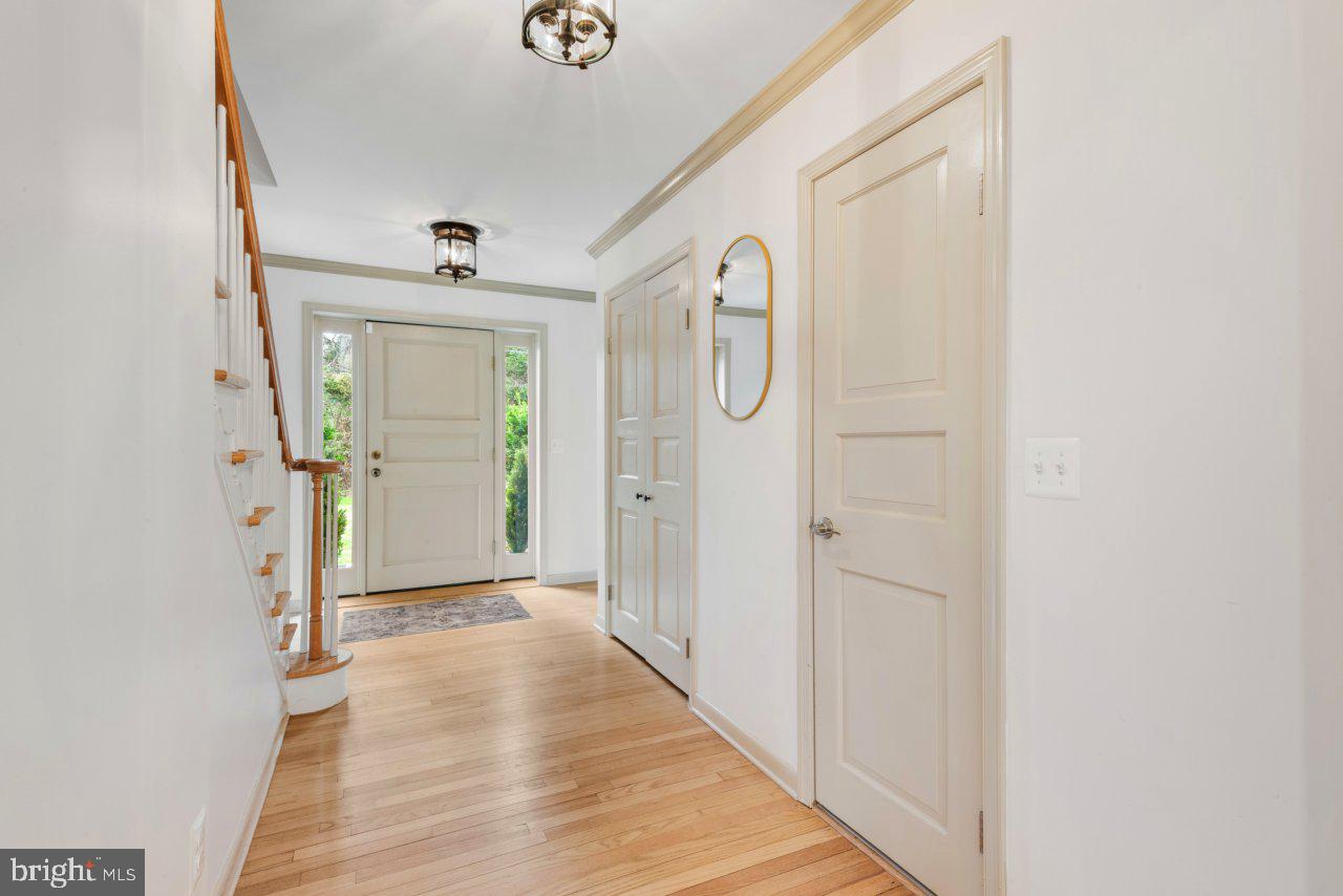 1803 Thornton Ridge Road Baltimore, MD 21204 - Photo 32 of 81 a view of a hallway with wooden floor and closet