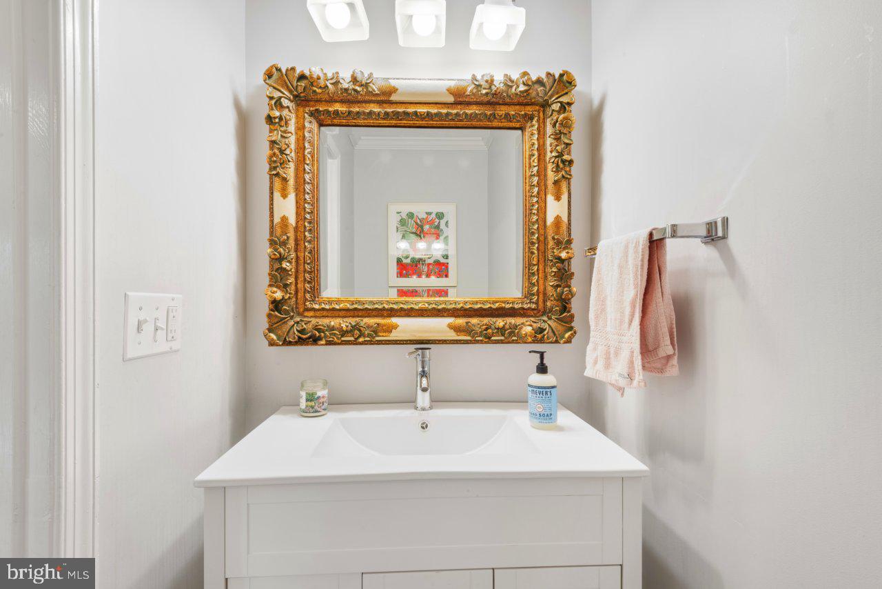 1803 Thornton Ridge Road Baltimore, MD 21204 - Photo 35 of 81 a bathroom with a sink and a mirror