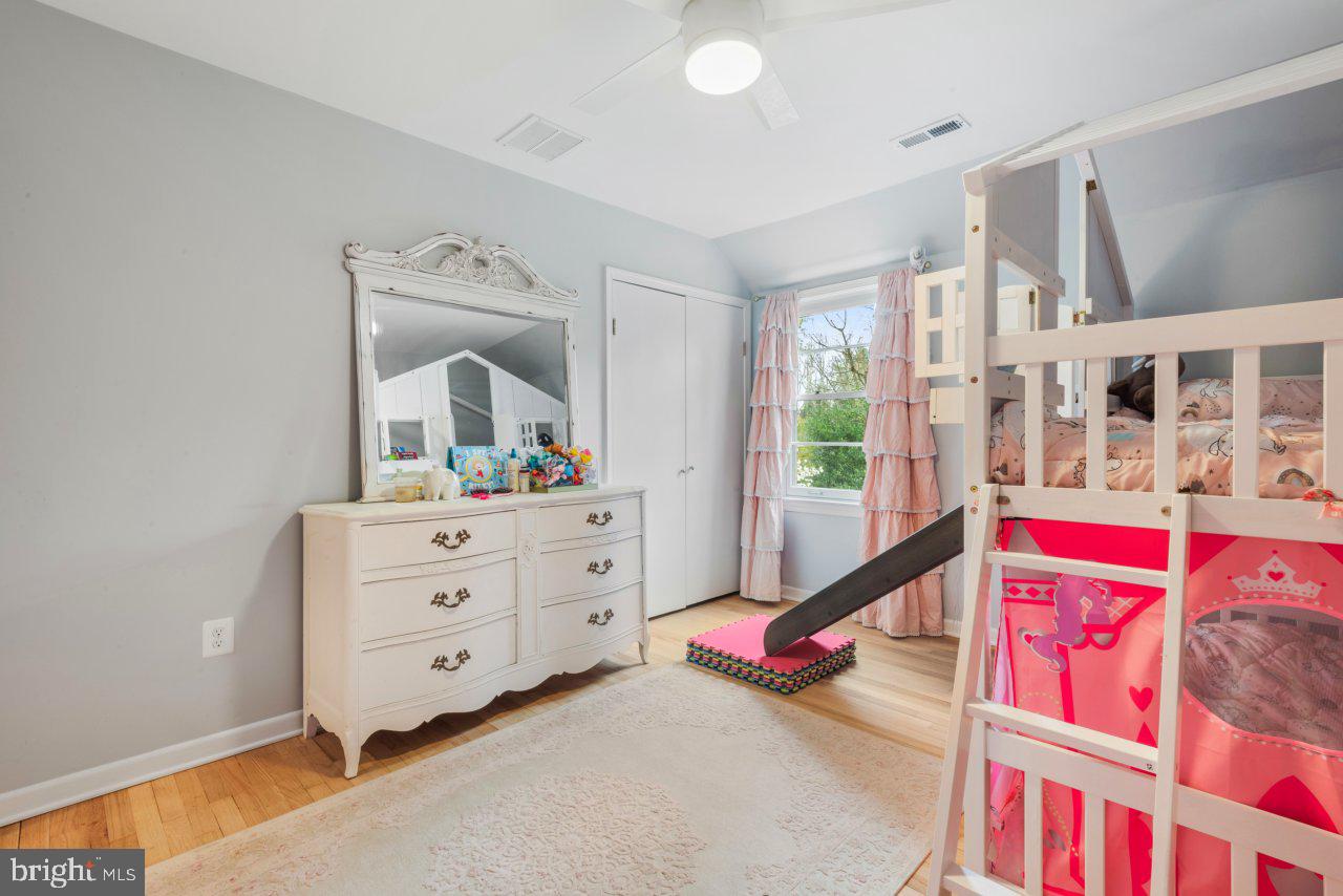 1803 Thornton Ridge Road Baltimore, MD 21204 - Photo 51 of 81 a bed room with a bed window and a mirror
