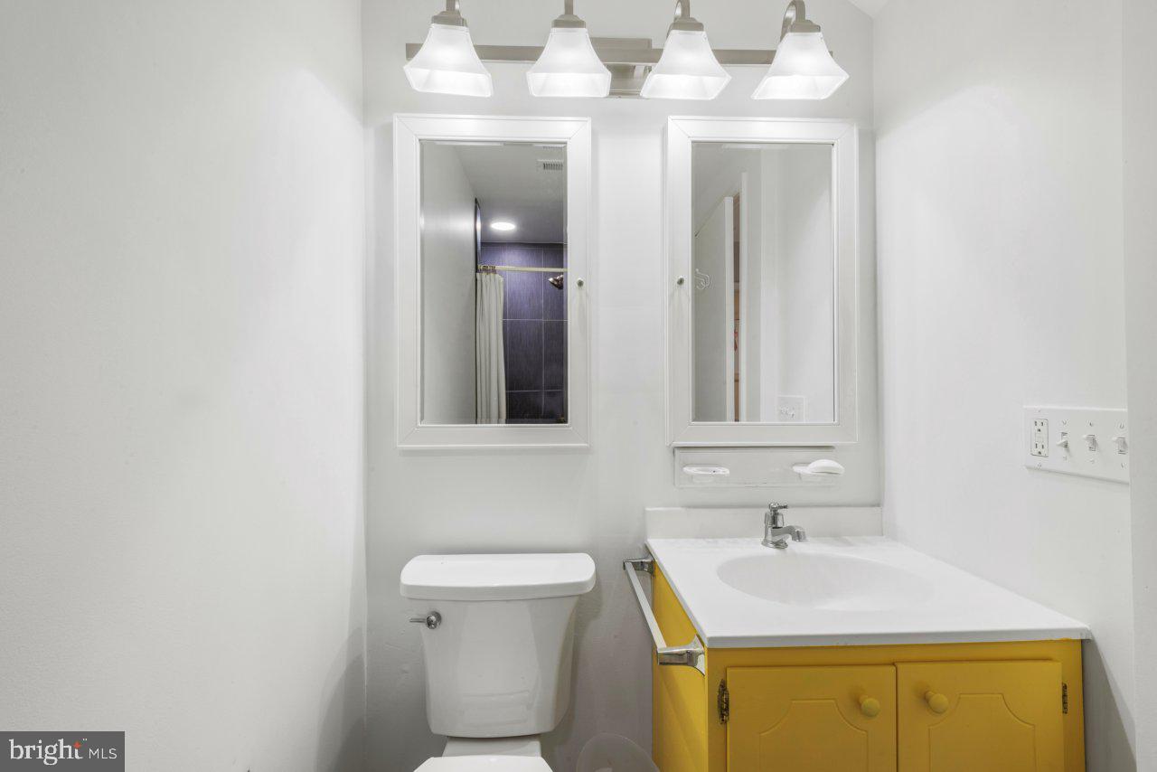 1803 Thornton Ridge Road Baltimore, MD 21204 - Photo 59 of 81 a bathroom with a sink and a mirror