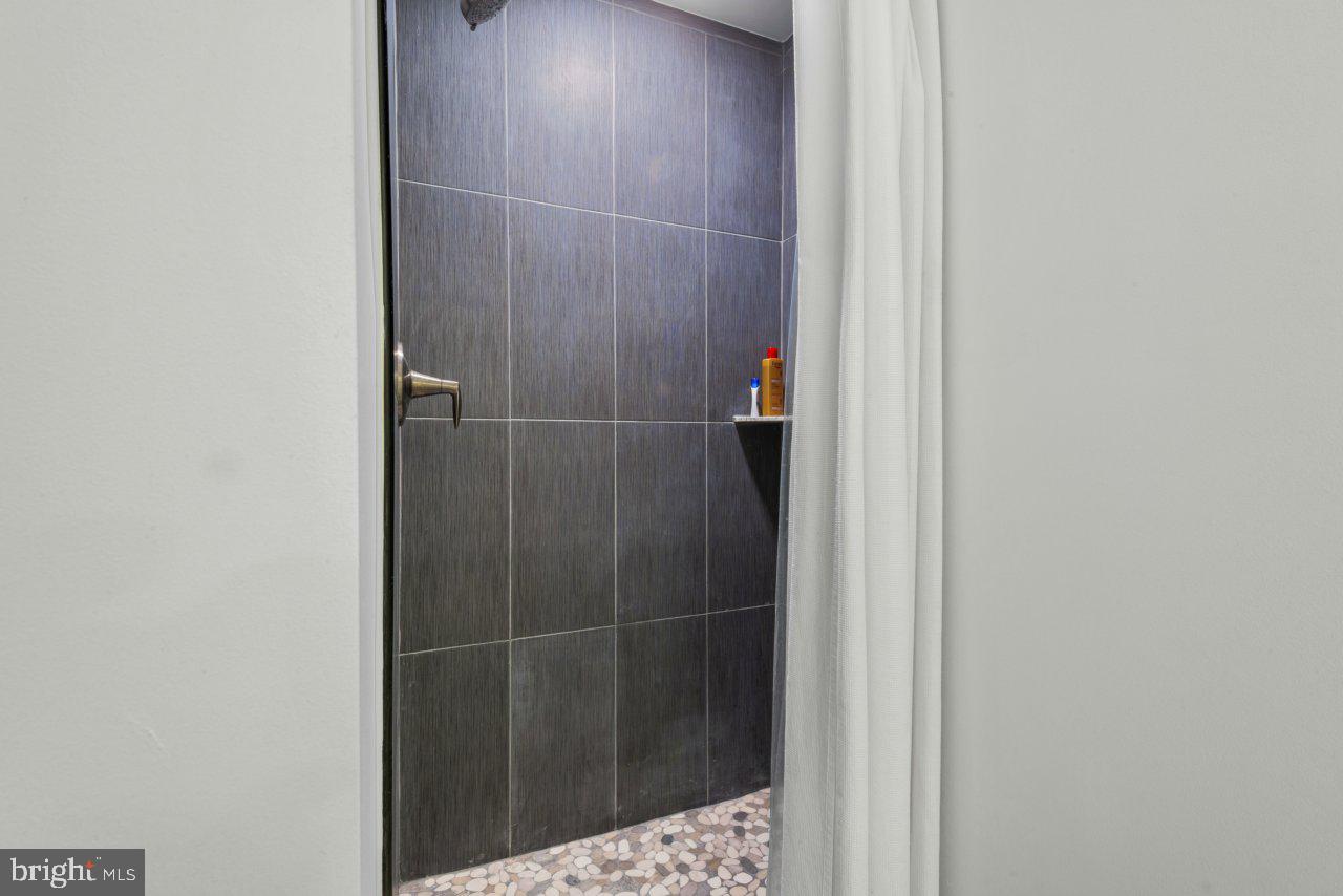 1803 Thornton Ridge Road Baltimore, MD 21204 - Photo 60 of 81 a bathroom with a shower