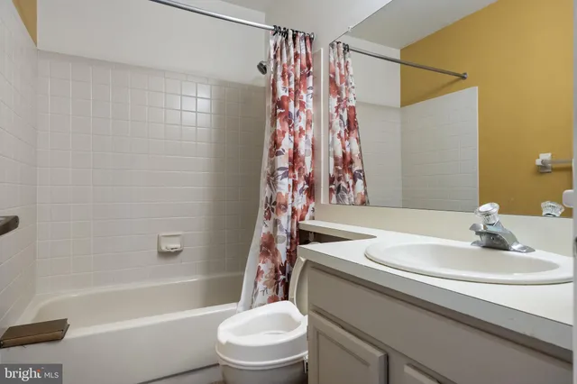 a bathroom with a sink a toilet and a bathtub