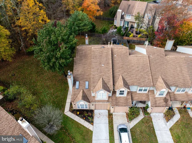 an aerial view of a house with outdoor space